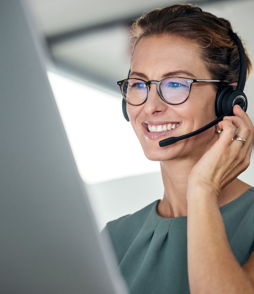 Customer service, woman and happy call center agent giving advice online using a headset. Operator, telemarketing and support with hotline consultant working for contact us help or arm consulting