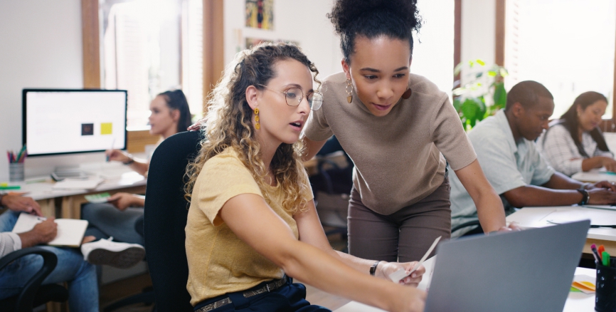 Talking, planning and business people in training with a laptop for leadership and mentoring. Meeting, project management and women speaking about online strategy, ideas or inspiration at work