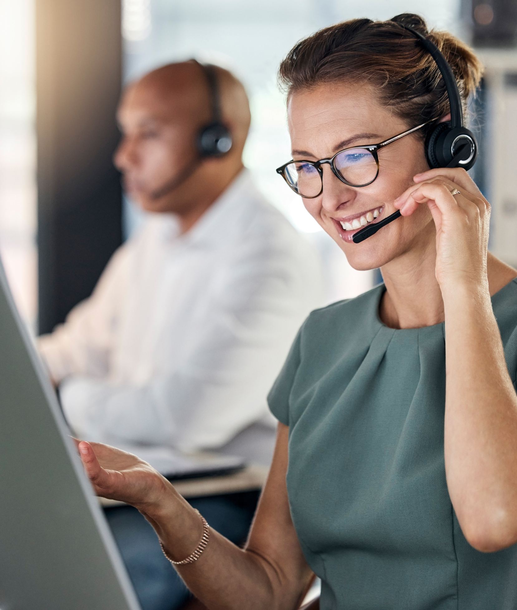 Customer service, call center and crm with a woman consultant working in a telemarketing office. Support, computer and sales with a female consulting using a headset for help, assist or communication