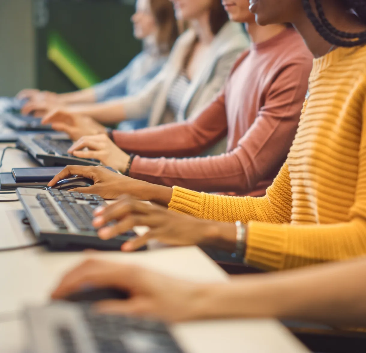 Workers typing on keyboards